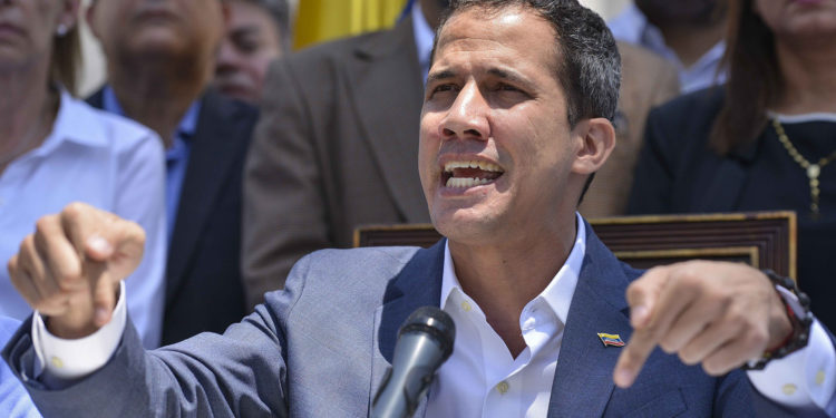 Venezuelan opposition leader and self-proclaimed acting president Juan Guaido speaks during a press conference at the Venezuelan National Assembly in Caracas on March 10, 2019. - Sunday is the third day Venezuelans remain without communications, electricity or water, in an unprecedented power outage that already left 15 patients dead and threatens with extending indefinitely, increasing distress for the severe political and economic crisis hitting the oil-rich South American nation. (Photo by Matias DELACROIX / AFP)