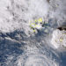 In this satellite image taken by Himawari-8, a Japanese weather satellite, and released by the agency, shows an undersea volcano eruption at the Pacific nation of Tonga Saturday, Jan. 15, 2022. An undersea volcano erupted in spectacular fashion near the Pacific nation of Tonga on Saturday, sending large waves crashing across the shore and people rushing to higher ground. (Japan Meteorology Agency via AP)