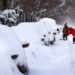 CHICAGO, ILLINOIS - FEBRUARY 16: People work to dig out their car along a residential street on February 16, 2021 in Chicago, Illinois. Chicago residents are digging out this morning after a snowstorm coupled with lake-effect snow dumped more than 17 inches of snow in some areas of the city since yesterday.   Scott Olson/Getty Images/AFP (Photo by SCOTT OLSON / GETTY IMAGES NORTH AMERICA / AFP)