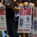 RENO, NEVADA, UNITED STATES - 2021/10/16: Union members on strike holding placards expressing their opinion at a march.
Union members and community members march in protest against Keolis management (multinational transportation company that operates public transport systems) after bus riders faced with disruptive new schedule. Local teamsters 533 remains on strike after negotiations failed. (Photo by Ty O'Neil/SOPA Images/LightRocket via Getty Images)