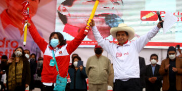 LIMA, PERU - MAY 18: Presidential candidate Pedro Castillo (R) and Vice Presidential candidate Dina Boluarte (L) greet supporters during a campaign event to present his working team ahead of the Presidential runoff at Estadio El Dorado on May 18, 2021 in Puente Piedra, Lima, Peru. (Photo by Raul Sifuentes/Getty Images)