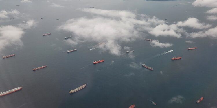 Ships wait to enter the Panama Canal on Wednesday, May 18, 2022.