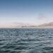 View across Pacific Ocean towards land in the distance.