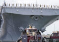 NORFOLK, Va. (Aug. 14, 2025) - Sailors and Marines man the rails aboard the Wasp-class amphibious assault ship USS Iwo Jima (LHD 7) as it departs Naval Station Norfolk for a regularly scheduled deployment. Sailors and Marines of the Iwo Jima Amphibious Ready Group (IWO ARG) - 22nd Marine Expeditionary Unit (MEU) Special Operations Capable (SOC) departed Norfolk and Camp Lejeune, North Carolina after completing a comprehensive, nine-month training program. (U.S. Navy photo by Mass Communication Specialist 1st Class Clay Whaley)