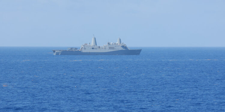 CARIBBEAN SEA (Aug. 28, 2025) The amphibious transport dock USS San Antonio (LPD 17) maneuvers to formation with the rest of the Iwo Jima Amphibious Ready Group (IWO ARG) during its regularly scheduled deployment to the U.S. Fourth Fleet area of responsibility. U.S. Naval Forces Southern Command/U.S. Fourth Fleet is the trusted maritime partner for Caribbean, Central and South America maritime forces leading to improved unity, security, and stability. (U.S. Navy Photo by Mass Communication Specialist Seaman Brendan Watt)