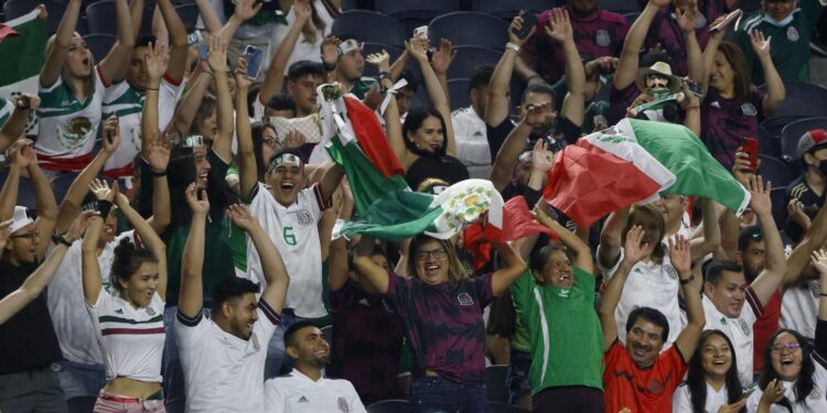 Mexico fans cheer during the first half of a CONCACAF Gold Cup Group A soccer match against Trinidad and Tobago in Arlington, Texas, Saturday, July 10, 2021. (AP Photo/Michael Ainsworth)